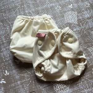 2 Newborn diaper covers - petite crown yellow
